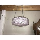 A pink mottled uplighter lampshade.