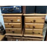 A pair of pine bedside 3 drawer cabinets