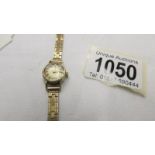 A 9ct gold ladies wrist watch.