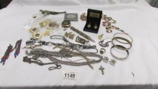 A mixed lot including earrings, necklaces, cuff links etc.