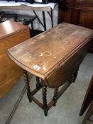 An oak barley twist gate leg table.