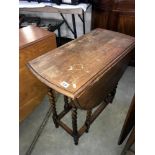 An oak barley twist gate leg table.