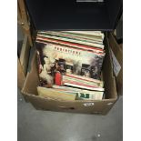 A quantity of LPs and 45 rpm records and an empty case