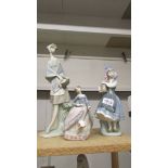 A Lladro tall girl with basket, A Lladro girl with flowers and a Lladro lady with parasol.