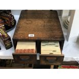 An Edwardian oak filing drawers