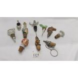 A mixed lot of novelty bottle stoppers and corks including a stag, horse head, Dewar's whisky etc.