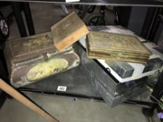 A shelf of tin boxes including collectors tins