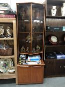 A 1970's 'JS' satcol teak wall unit with smoke glass doors