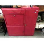 A red painted cupboard.