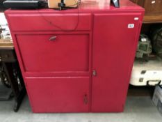 A red painted cupboard.