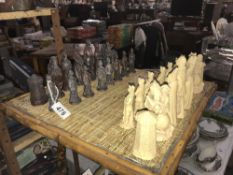 An incomplete set of plaster chess pieces depicting English civil war figurines,