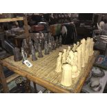 An incomplete set of plaster chess pieces depicting English civil war figurines,