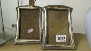 A pair of hall marked silver photograph frames. (Size of the frames: height 17cm x 12.