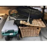 A fishing creel, tackle box, landing net and tackle.