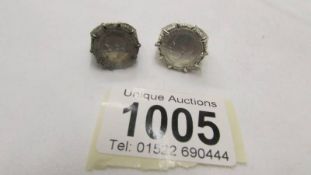 2 silver coin rings.