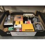 A box of camera accessories by Yashica, Arguet, Kodak etc.