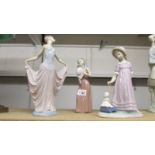 A LLadro figure of a girl pulling a doll in cart (thread frayed),