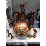 A selection of copper & brass ware including jugs kettle & candle sticks etc.