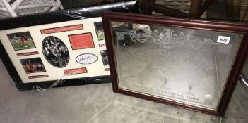 A Manchester United mirror and Manchester United signed picture