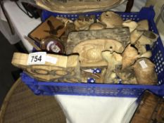 A tray of carved wooden items