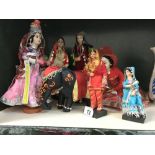 A quantity of costume dolls in Indian dress & an elephant