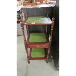 A mahogany stand with leather insets.