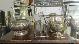 A mixed lot of silver plate including tea pot. coffee pot, toast rack etc.