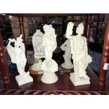 5 white figurines