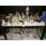 2 shelves of assorted animal figures etc.