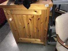 A pine single door cupboard