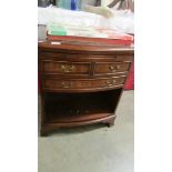 A mahogany effect cabinet.