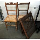 2 cane seated chairs & an antique day bed