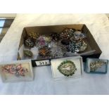 A mixed lot of costume brooches