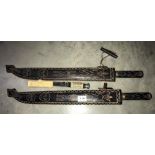Two collectors wall hanging machetes