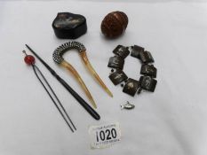 A mixed lot of interesting items including carved wooden egg, hair decorations,
