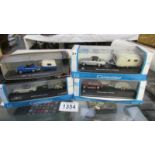 4 boxed miniature die cast cars with caravans - VW Beetle, Porsche, MGB, VW Beetle.