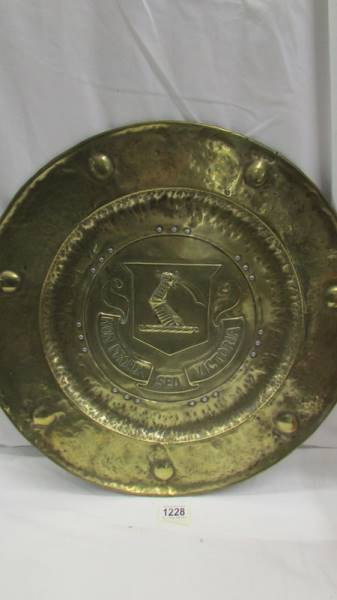 An Army & Navy stores copper flask and a large brass wall plaque depicting a coat of arms. - Image 3 of 3