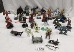 Approximately 30 Star Wars figures.