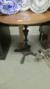 A cast iron table with oak top.