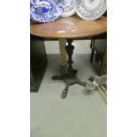 A cast iron table with oak top.