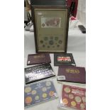 A framed and glazed Currency of Great Britain collages and 6 boxed UK coins sets.
