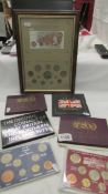 A framed and glazed Currency of Great Britain collages and 6 boxed UK coins sets.