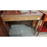 A mahogany fold over tea table.