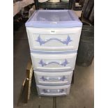 A set of 4 drawer plastic drawers