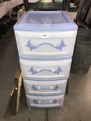 A set of 4 drawer plastic drawers