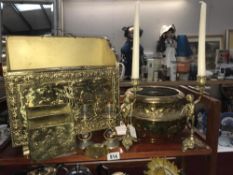 A shelf of brassware including magazine rack etc.