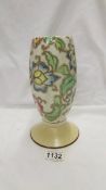 A Tuscan Decord pottery 9" tall vase on a yellow/cream foot with floral style decoration (art