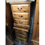 A pair of 3 drawer pine bedroom chests