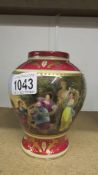 A hand painted vase with classical scenes.