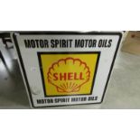 A Shell Motor Oil metal sign.